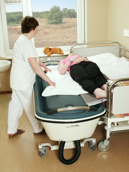 In en uit uw bed met het rolbord